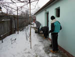 Boys cleaning snow Casa Trandafirilor